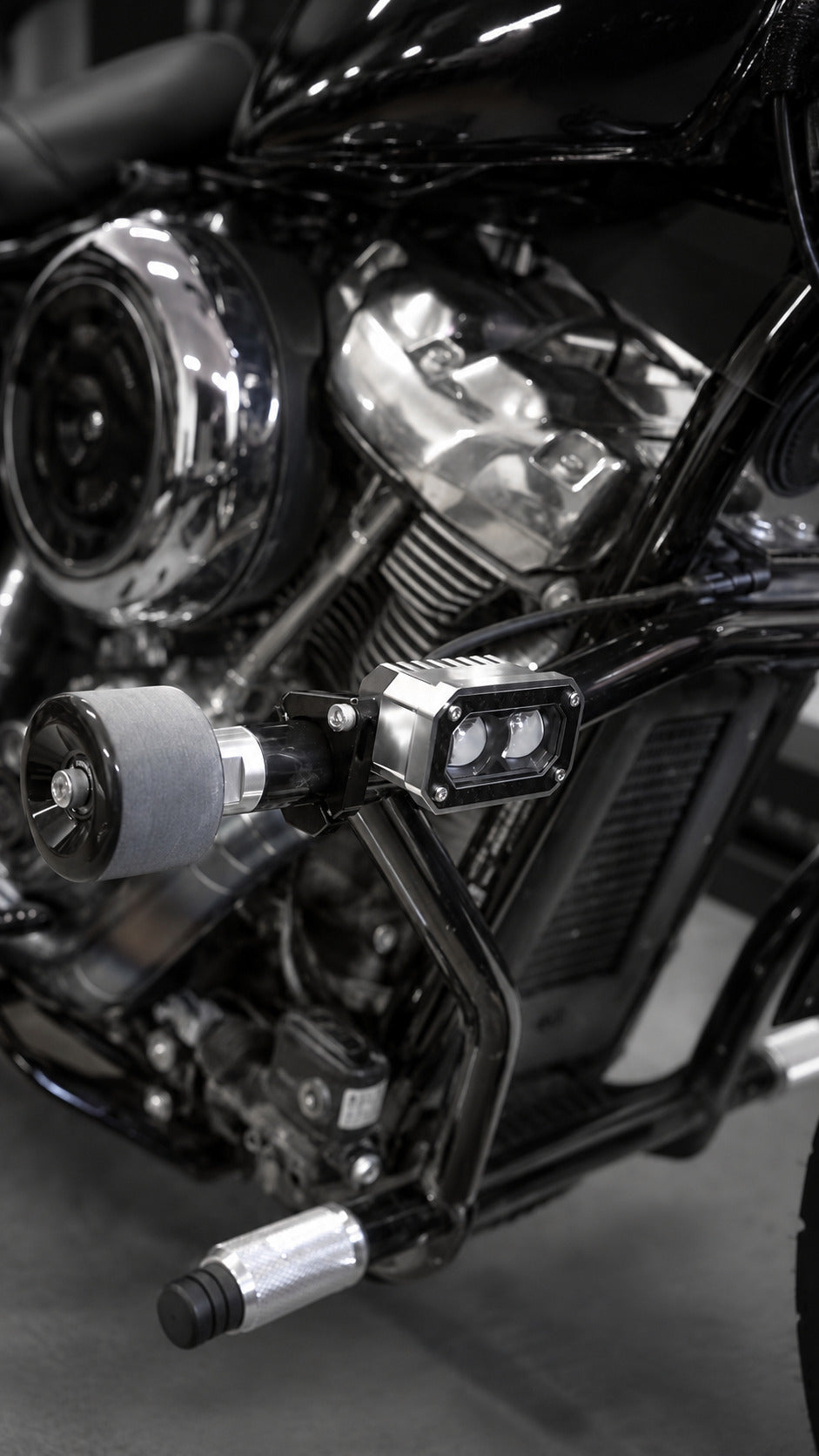 Black3 BK31 LED spot light for Harley-Davidson, installed on a Harley crash bar