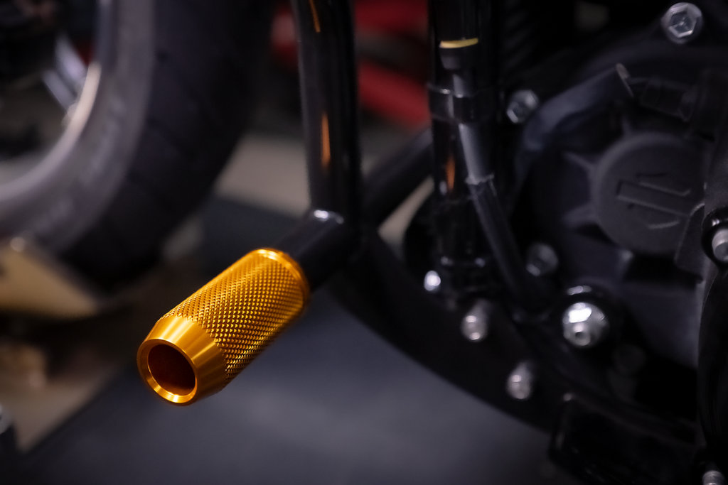 CNC crashbar sliders for Harley-Davidson, gold, installed