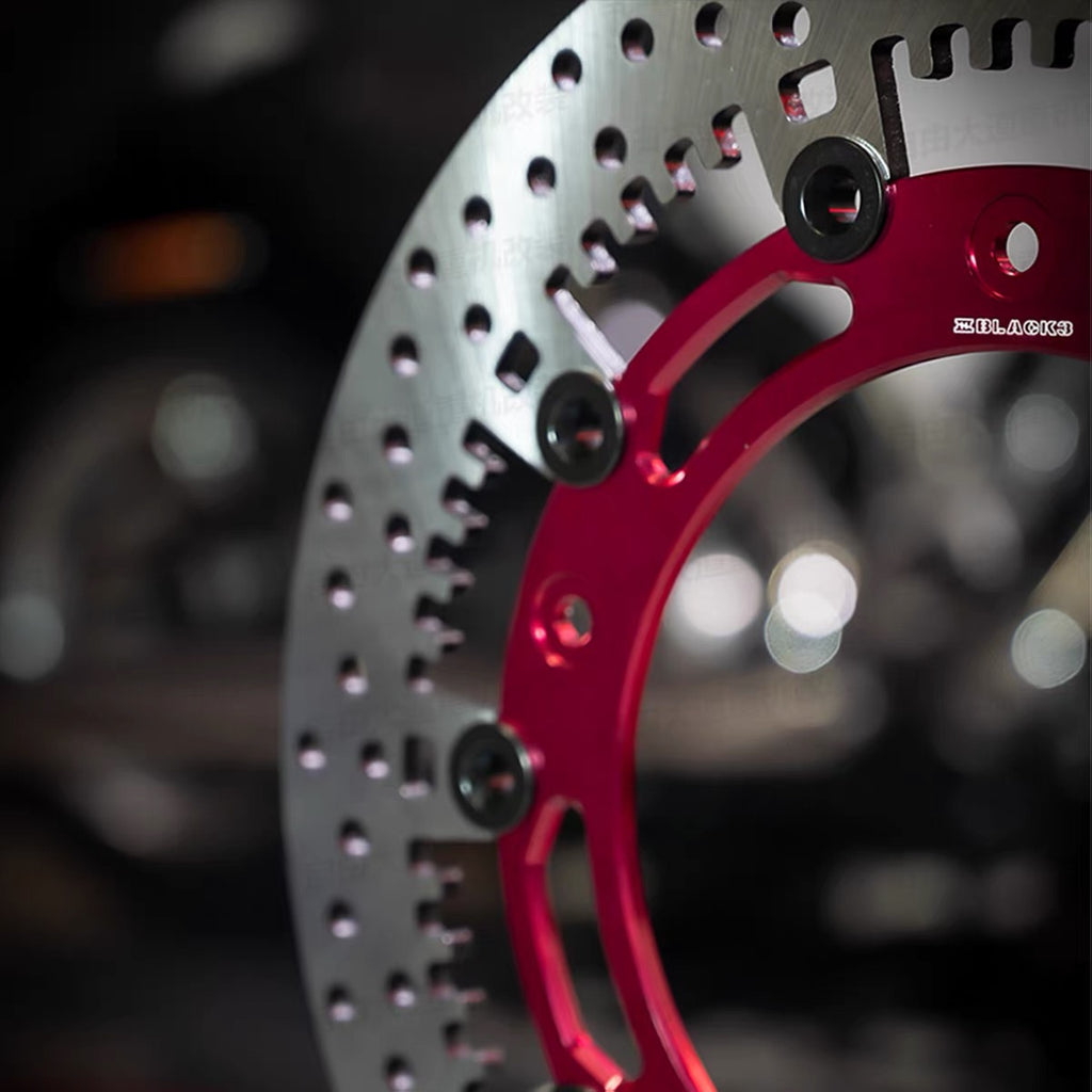 Black3 floating brake rotor for Harley-Davidson, red carrier and floating button detail